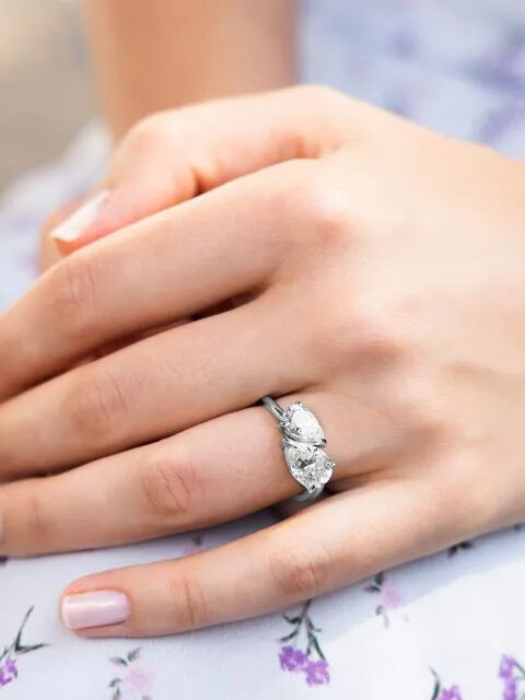 Close up of a moissanite ring on a model's hand from Charles & Colvard