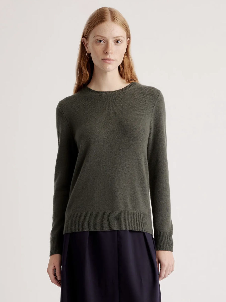 A model in a sweater from Quince