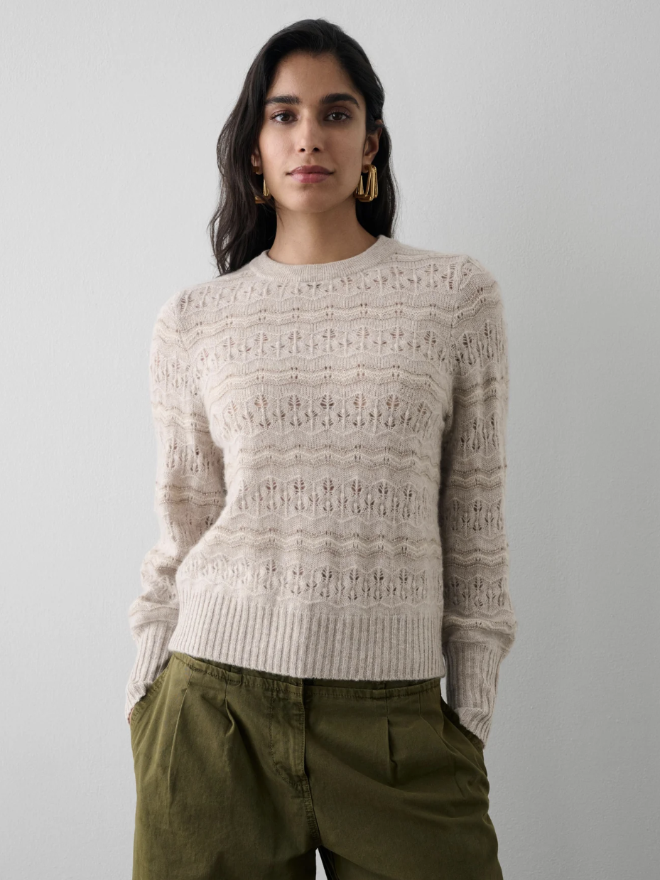 A model in a sweater from White + Warren