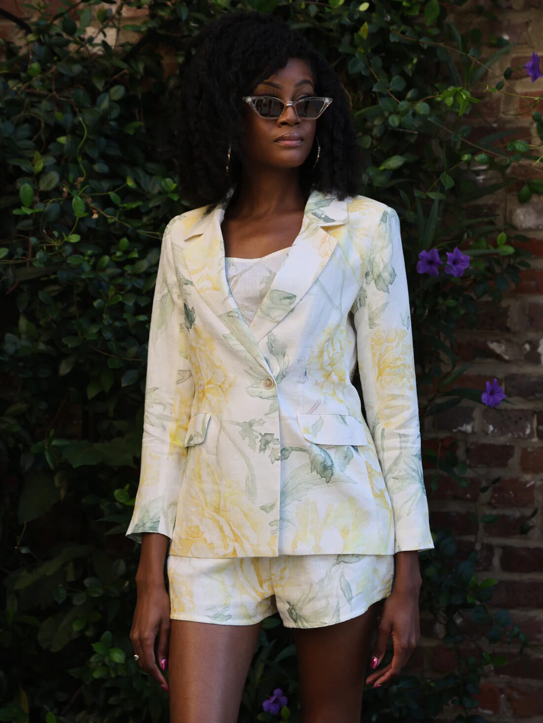 A model in sunglasses wearing FLORA By Alexandria's Rosalie Blazer and matching shorts.