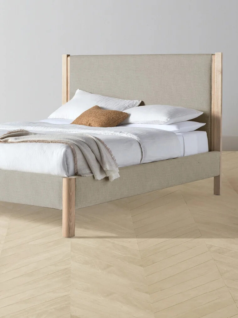 Wooden upholstered bed frame by Maiden Home.
