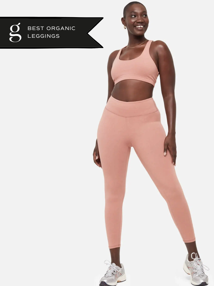 A model wears a coral cotton legging and bra set. 