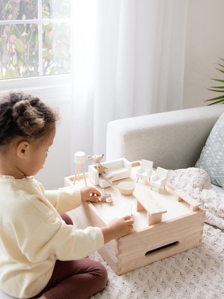 A child playing with Milton & Goose Montessori mini living set. 