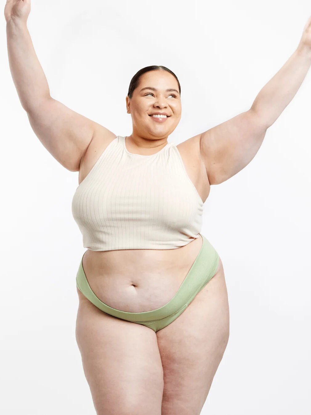 A model wearing light green Period Aisle underwear. 