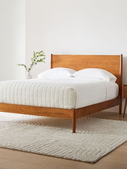 Wooden bed frame by West Elm.