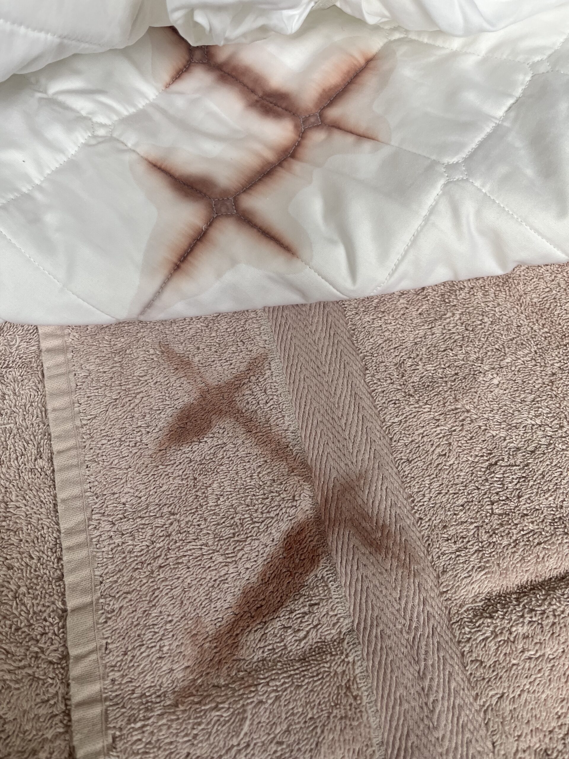 A wine spill on the mattress protector from Boll & Branch