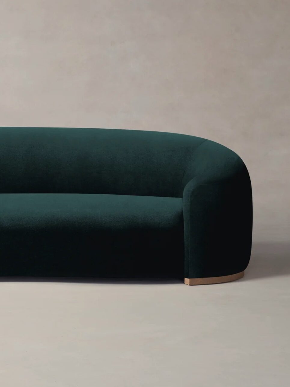 A sustainable velvelt green sofa from Maiden Home