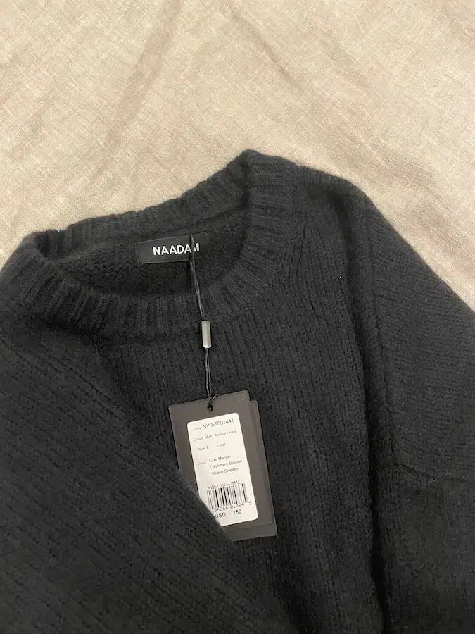 A close up of a Naadam cashmere sweater. 