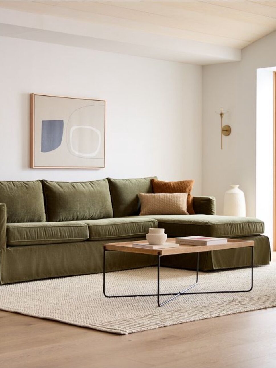 A sustainable velvelt green sofa from West Elm