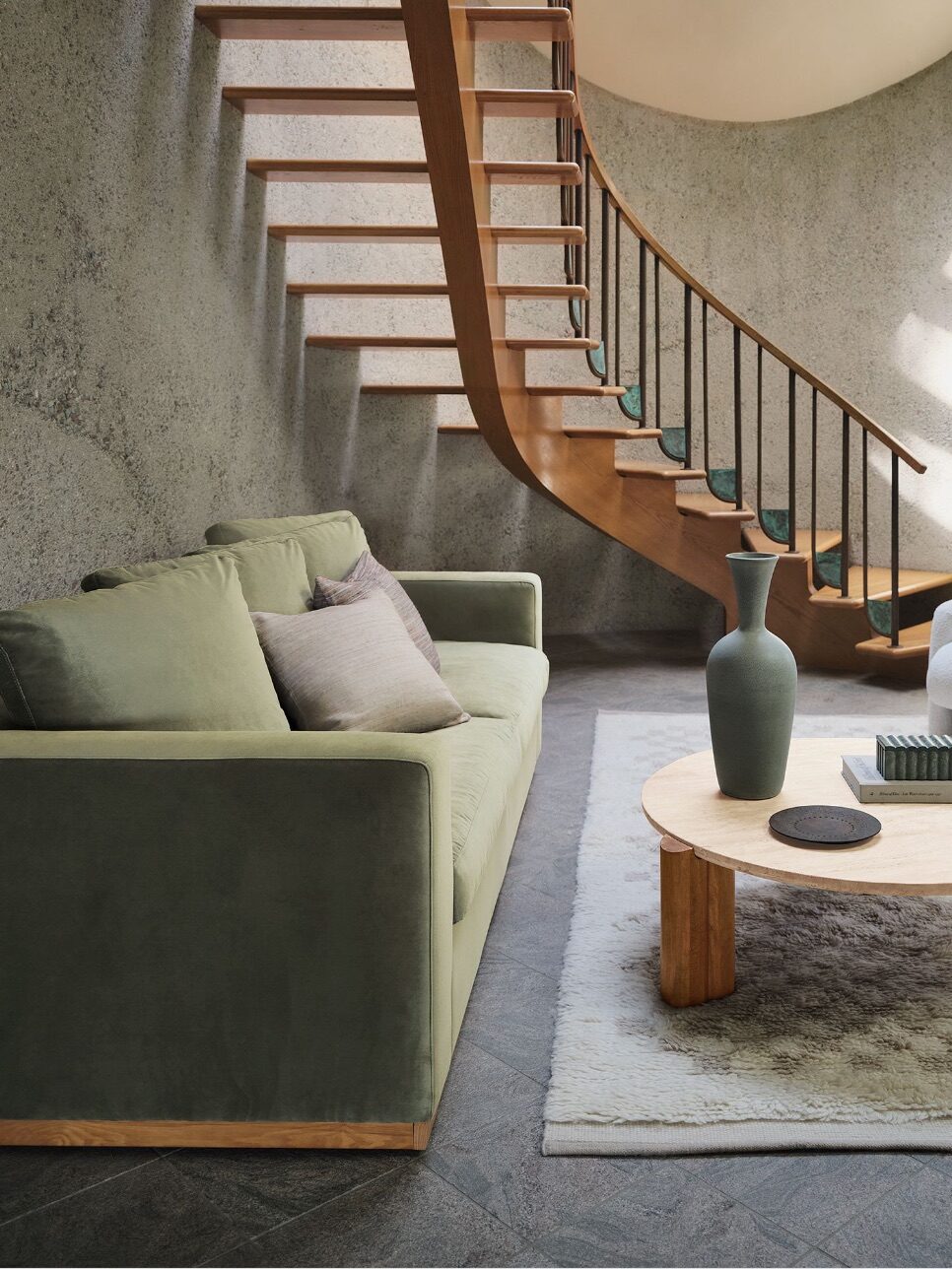 A sustainable velvelt green sofa from West Elm