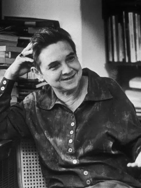 A black and white portrait of Adrienne Rich.