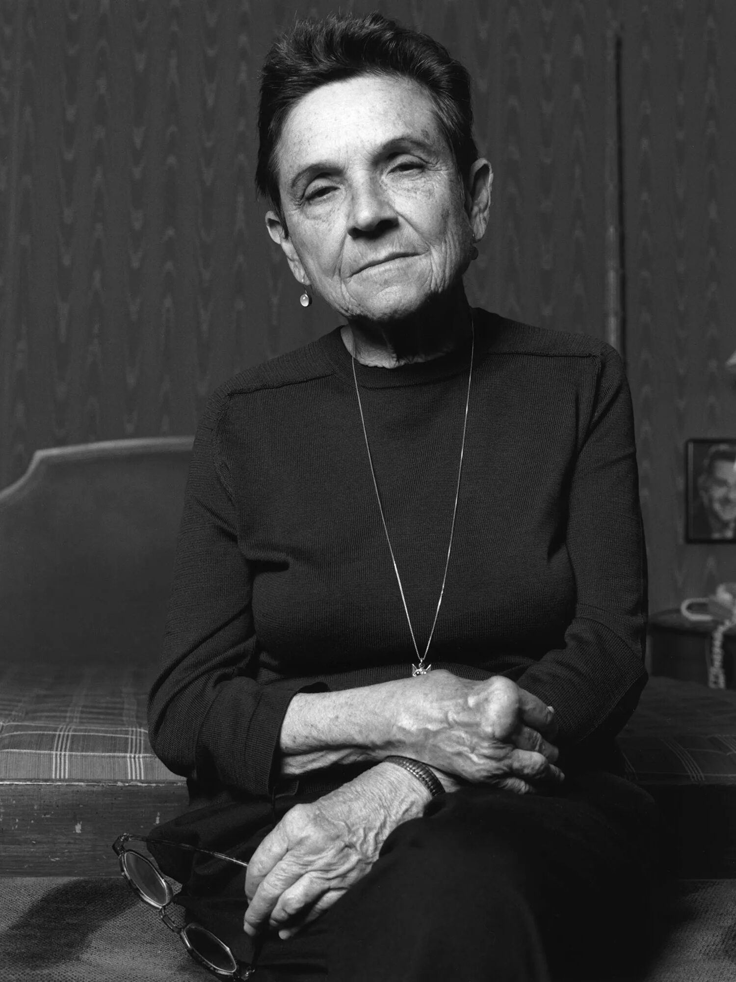 A black and white portrait of Adrienne Rich.