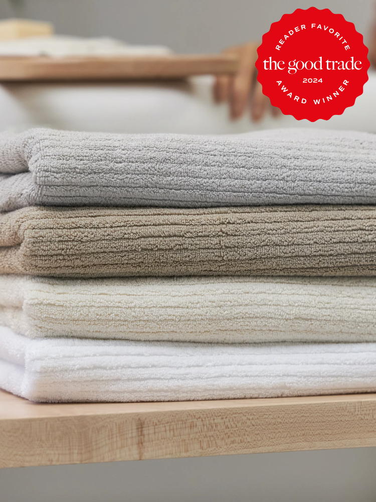 A stack of bath towels from Avocado. The TGT 2024 Award Winner Badge is on the right corner of the image. 