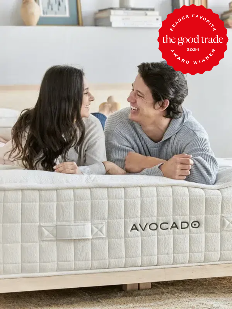 A couple laying on an Avocado Green Mattress. The TGT 2024 Award Winner Badge is on the right corner of the image. 