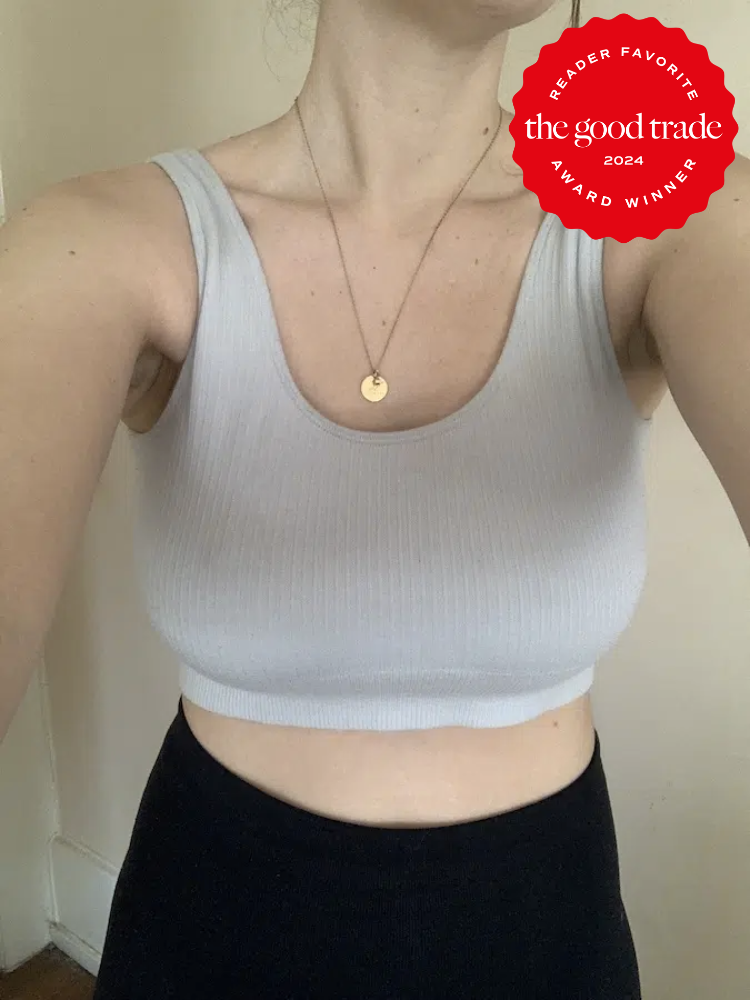 The Good Trade editor wearing a grey sports bra from Boody. The TGT 2024 Award Winner Badge is on the right corner of the image.