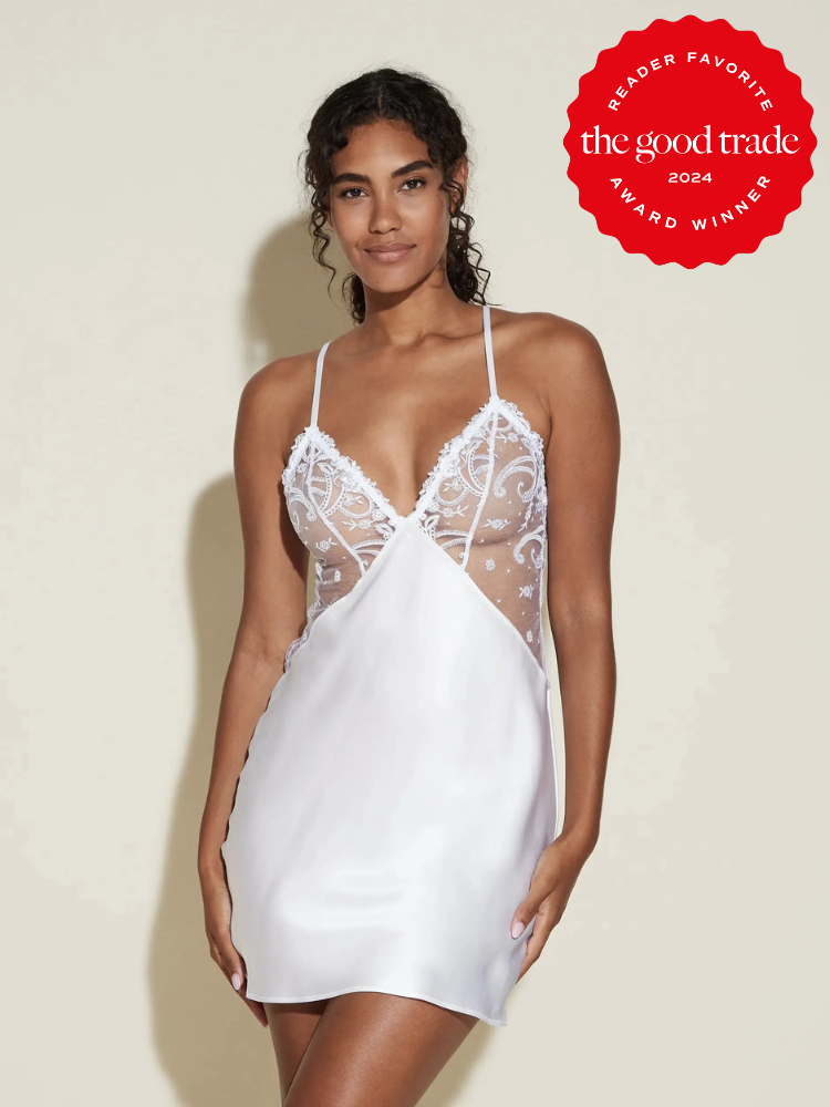 A model wearing a white and lace silk nightgown from Cosabella. The TGT 2024 Award Winner Badge is on the right corner of the image. 
