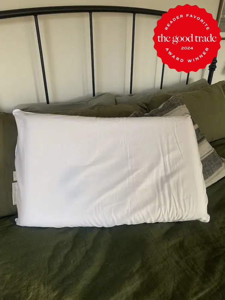 A Coyuchi organic pillow on a bed. The TGT 2024 Award Winner Badge is on the right corner of the image.