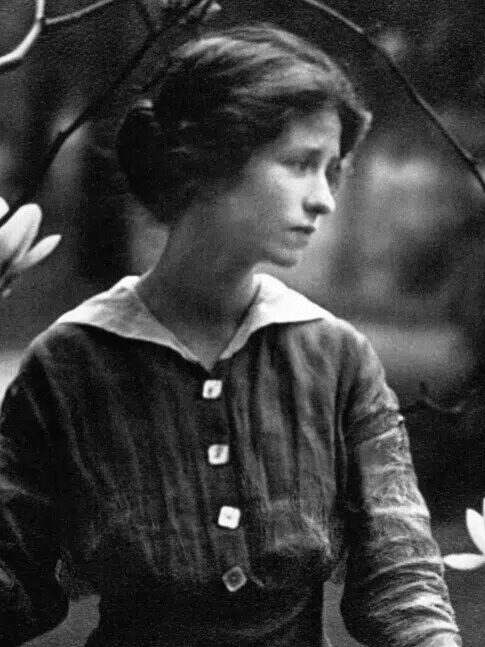 A black and white portrait of Edna St. Vincent Millay.
