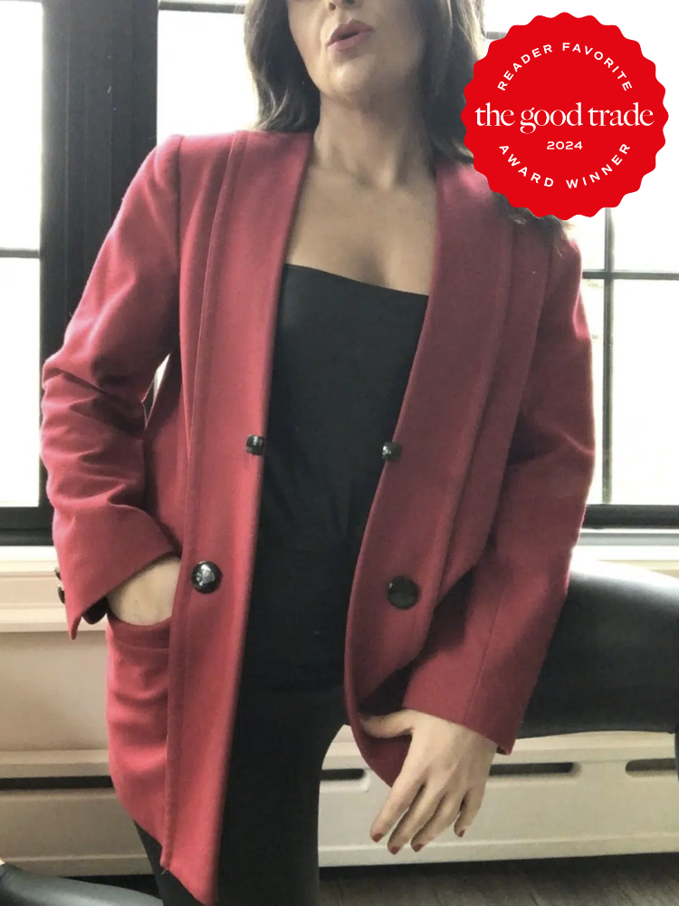 Close up shot of a model wearing Etsy shop "Mighty Oak Vintage Co.'s" blazer in red. The TGT 2024 Award Winner Badge is on the right corner of the image.
