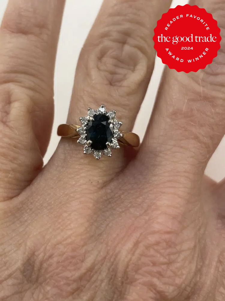 A close up of a vintage engagement rings from Etsy on a hand. The TGT 2024 Award Winner Badge is on the right corner of the image.