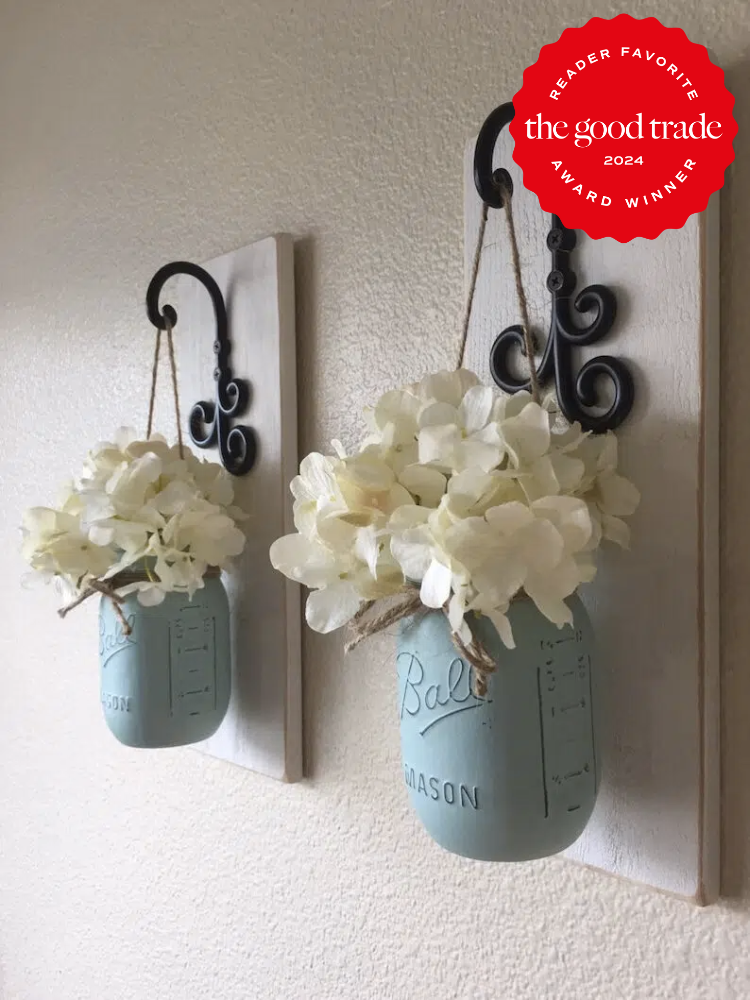 Homemade painted mason jars with flowers in them, hanging as wall decor, from Etsy. The TGT 2024 Award Winner Badge is on the right corner of the image.
