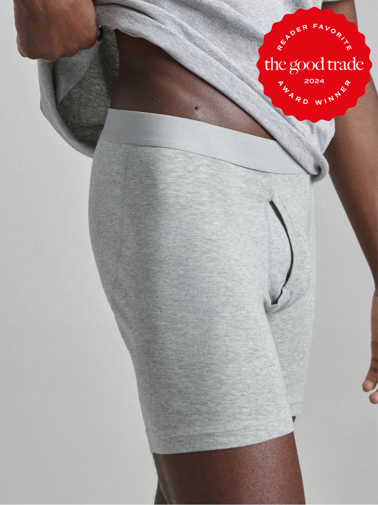 A close up shot of a model wearing grey longline boxers from Everlane. The TGT 2024 Award Winner Badge is on the right corner of the image.