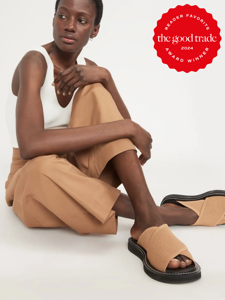 A model sits with her legs crossed, wearing Everlane sandals. The TGT 2024 Award Winner Badge is on the right corner of the image. 