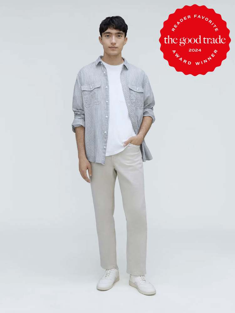 A model wearing white denim pants from Everlane. 