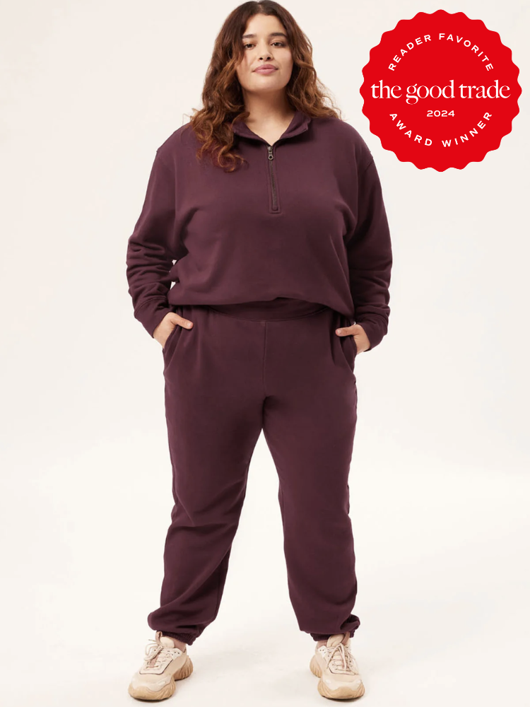 A plus size model in a Girlfriend Collective matching sweat set. The TGT 2024 Award Winner Badge is on the right corner of the image.