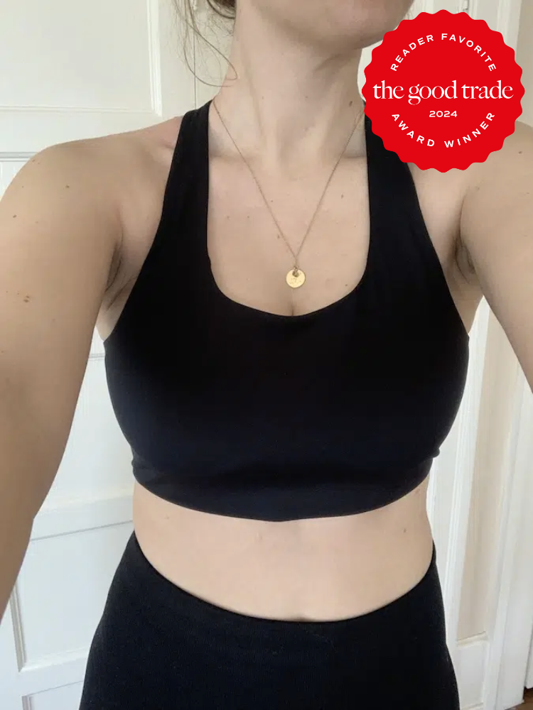 The Good Trade editor wearing a black sports bra from Girlfriend Collective. The TGT 2024 Award Winner Badge is on the right corner of the image.