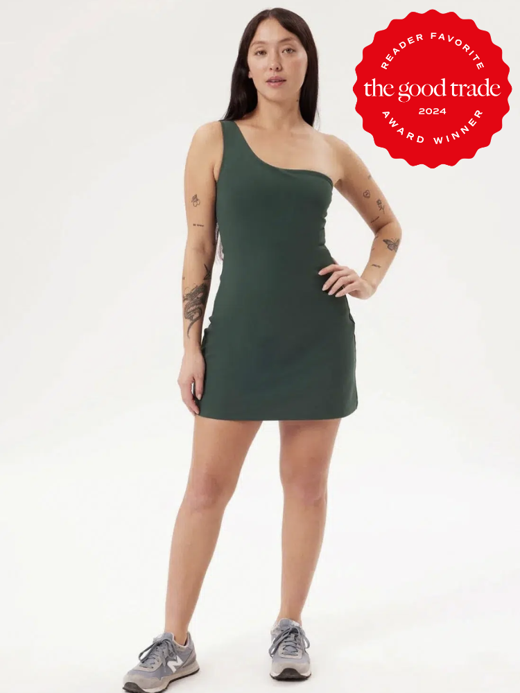 A model wears a fitted short one sleeve dress from Girlfriend Collective. The TGT 2024 Award Winner Badge is on the right corner of the image. 