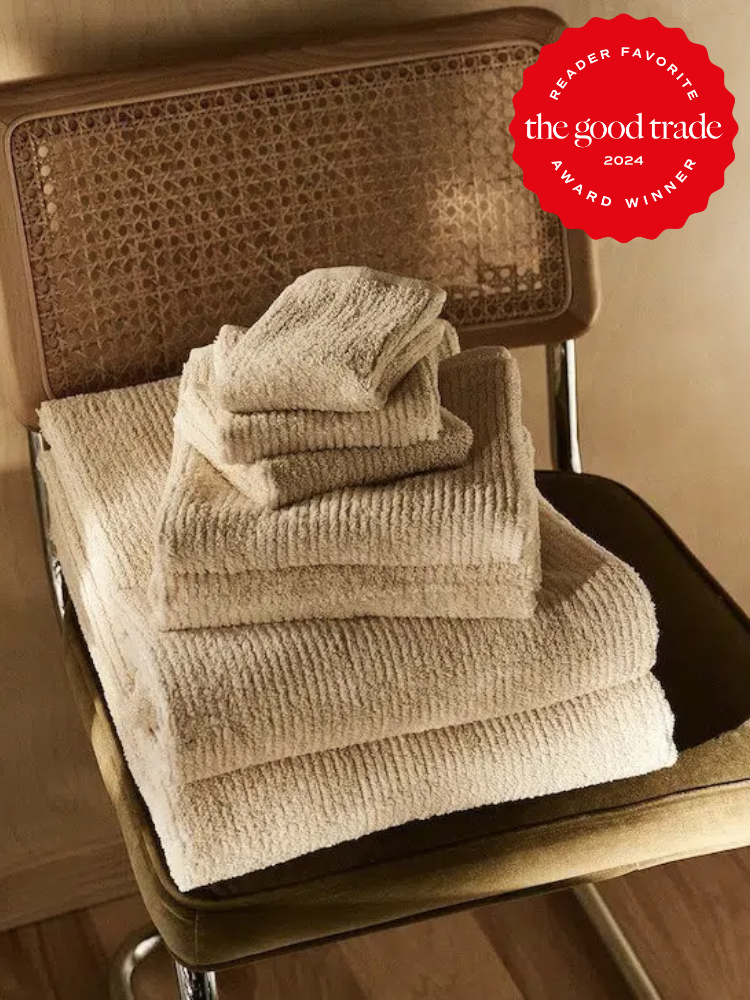 A stack of pact towels on a chair. The TGT 2024 Award Winner Badge is on the right corner of the image. 