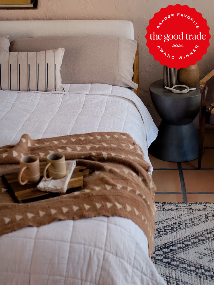 Pact organic comforters on a styled bed. The TGT 2024 Award Winner Badge is on the right corner of the image.