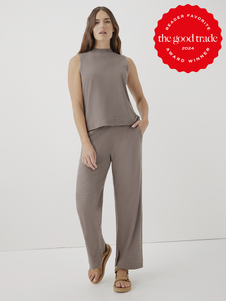 A model wearing a two piece mock neck tank and wide leg pants set from Pact.