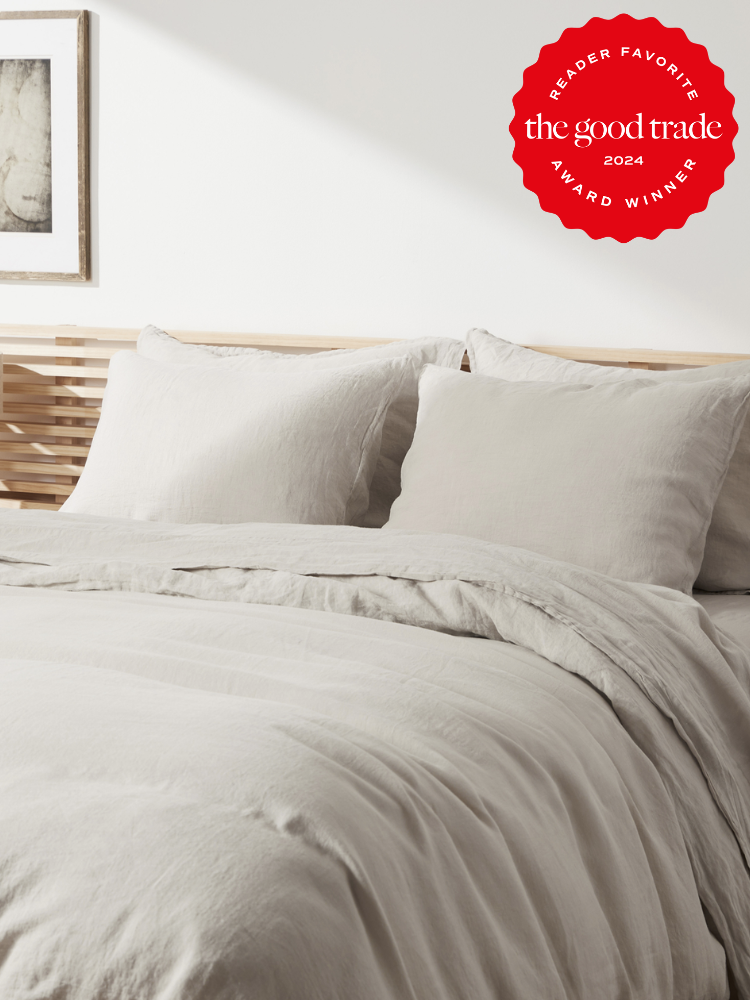 Light grey bed sheets from Parachute. The TGT 2024 Award Winner Badge is on the right corner of the image. 
