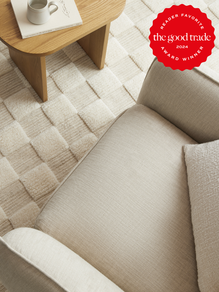 An overhead shot of a Parachute wool checkered rug. The TGT 2024 Award Winner Badge is on the right corner of the image. 