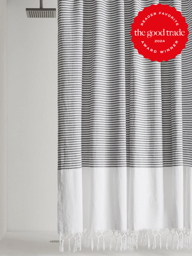 Striped fringe shower curtains from Parachute. The TGT 2024 Award Winner Badge is on the right corner of the image. 
