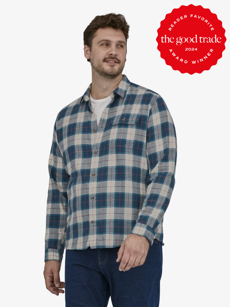 A model wearing a blue flannel shirt from Patagonia. 
