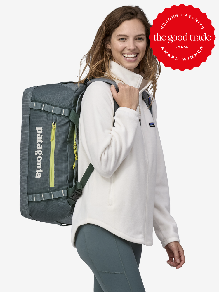 A woman carries a Patagonia duffle on her back; the TGT 2024 Reader Favorite award badge is on the right hand corner.