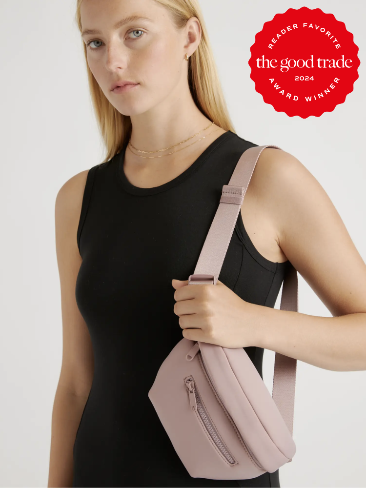 A model with a pink Quince fanny pack slung on their shoulder. The TGT 2024 Award Winner Badge is on the right corner of the image.