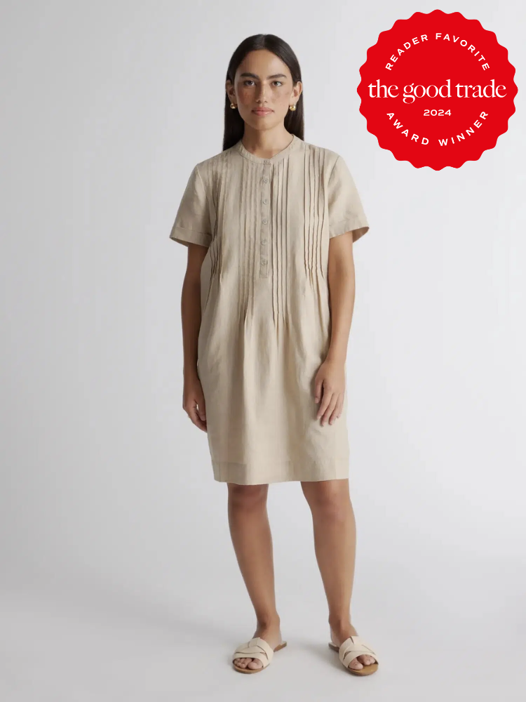 A model wearing a Quince linen dress. The TGT 2024 Award Winner Badge is on the right corner of the image.