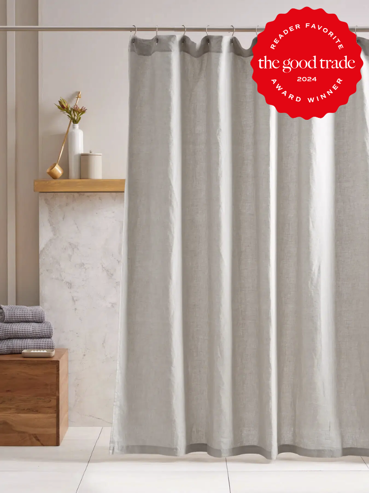 Light grey shower curtains from Quince. The TGT 2024 Award Winner Badge is on the right corner of the image. 
