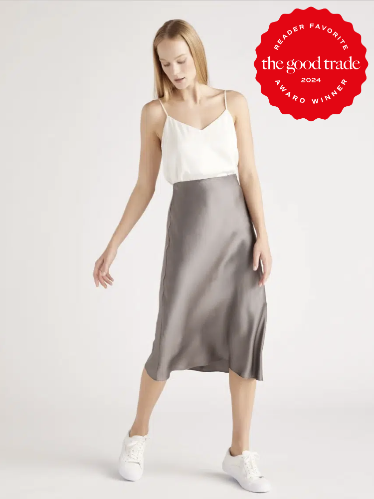 A model wearing a grey slip skirt from Quince. The TGT 2024 Award Winner Badge is on the right corner of the image.