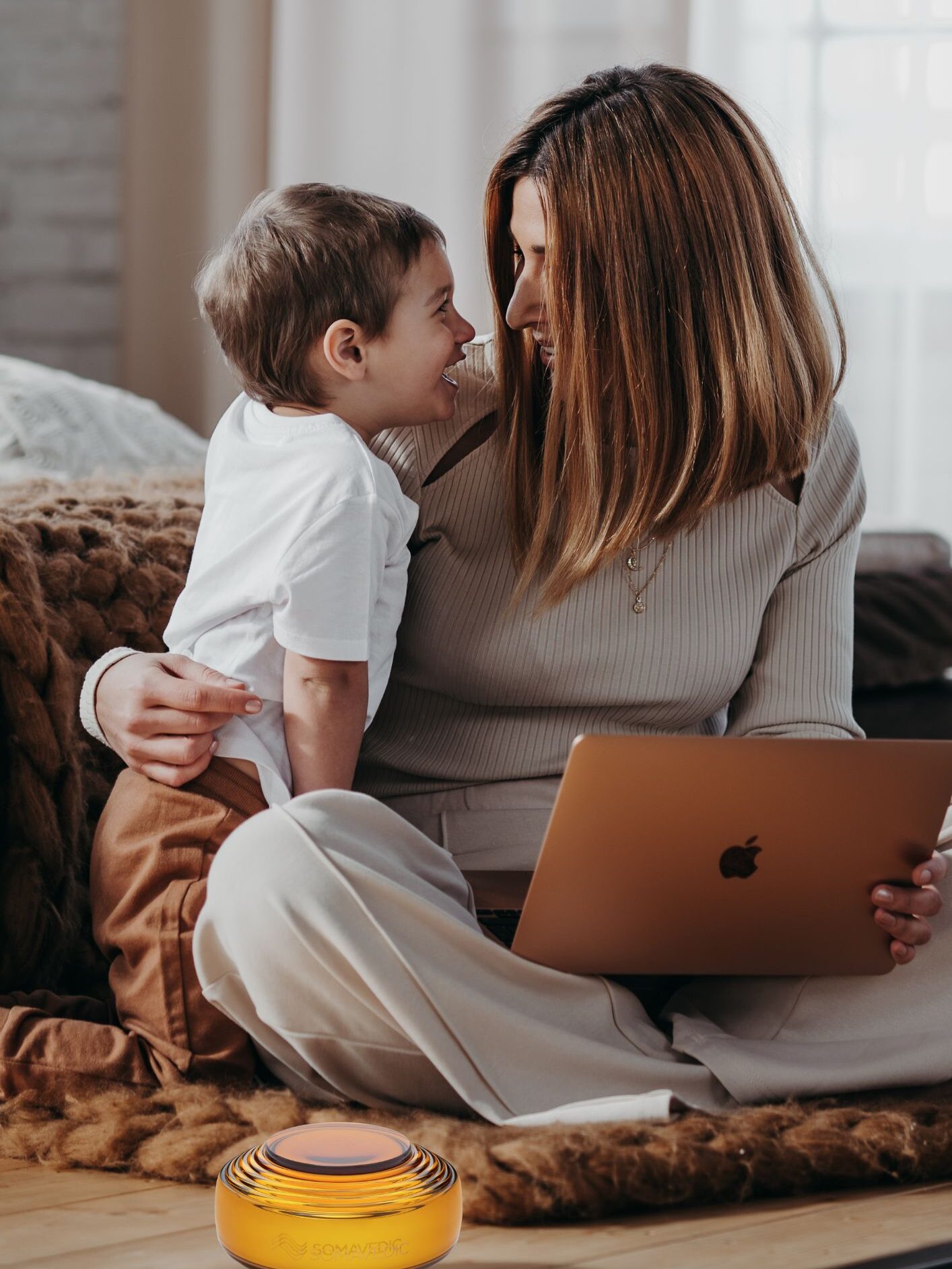 A Somavedic Harmony Device in a room with a mom and child laughing together.  