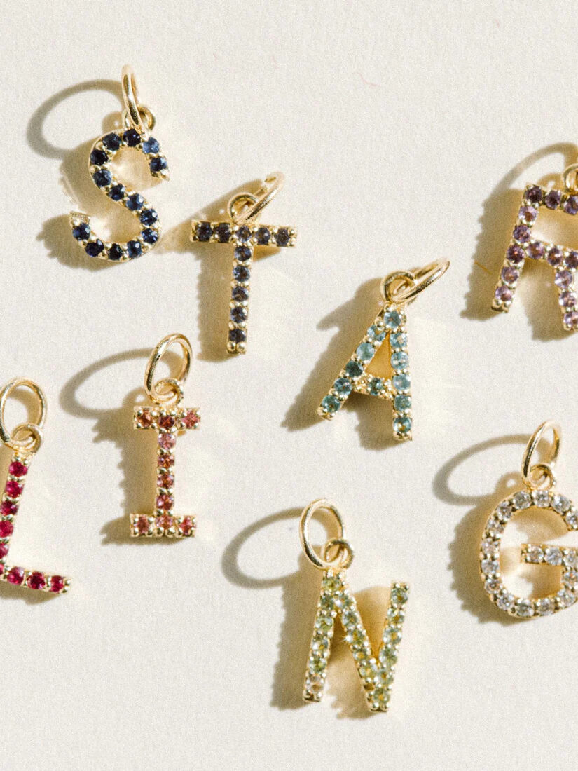 A variety of gemstone pendant letters from Starling. 
