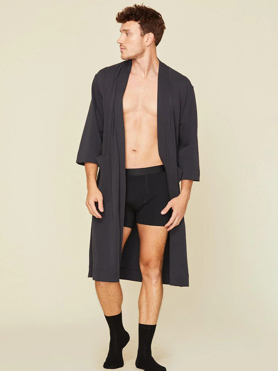 A model wearing a Subset robe and boxers in black.