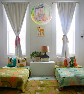 A child's bedroom with a Cold Picnic rug in the center.