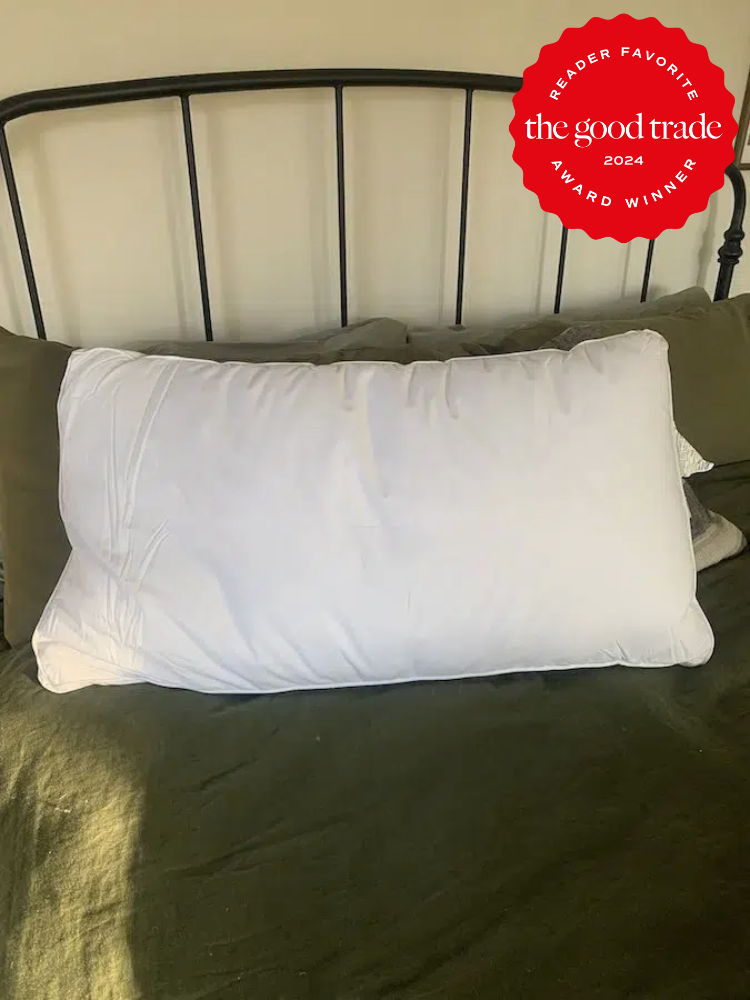 An Under the Canopy organic pillow on a bed. The TGT 2024 Award Winner Badge is on the right corner of the image.
