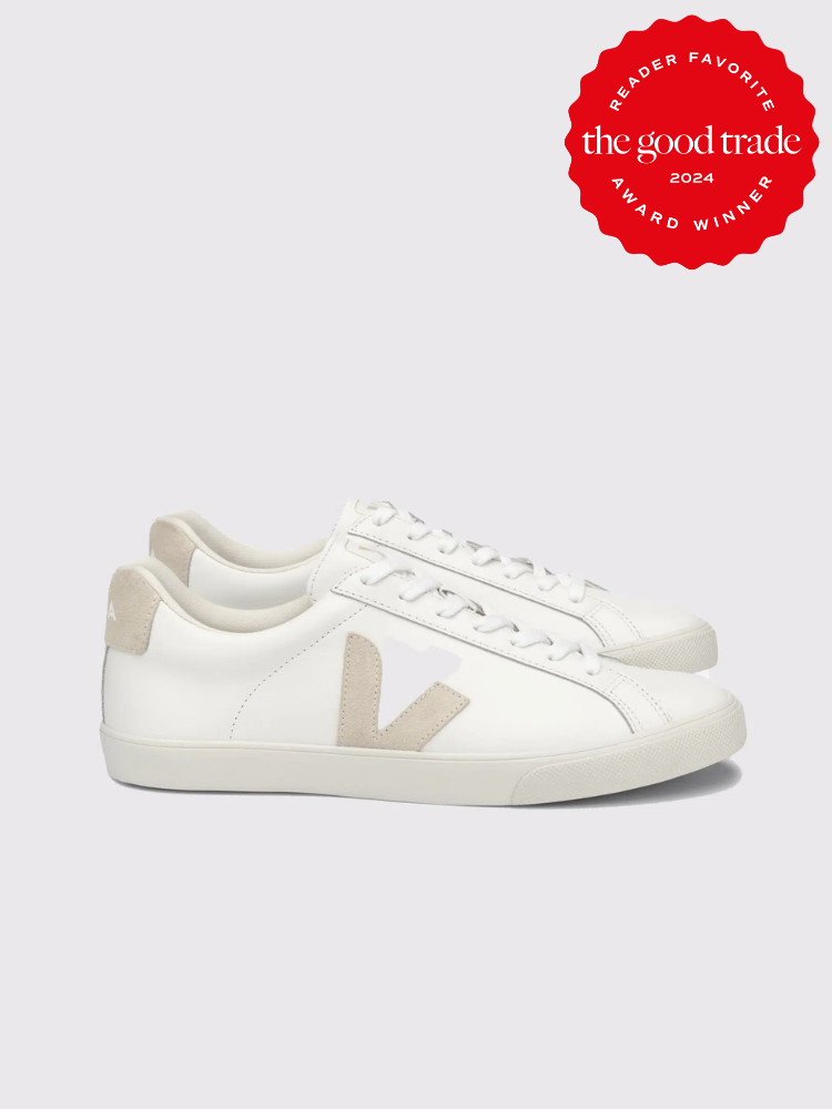 A pair of white and cream VEJA sneakers. The TGT 2024 Award Winner Badge is on the right corner of the image. 