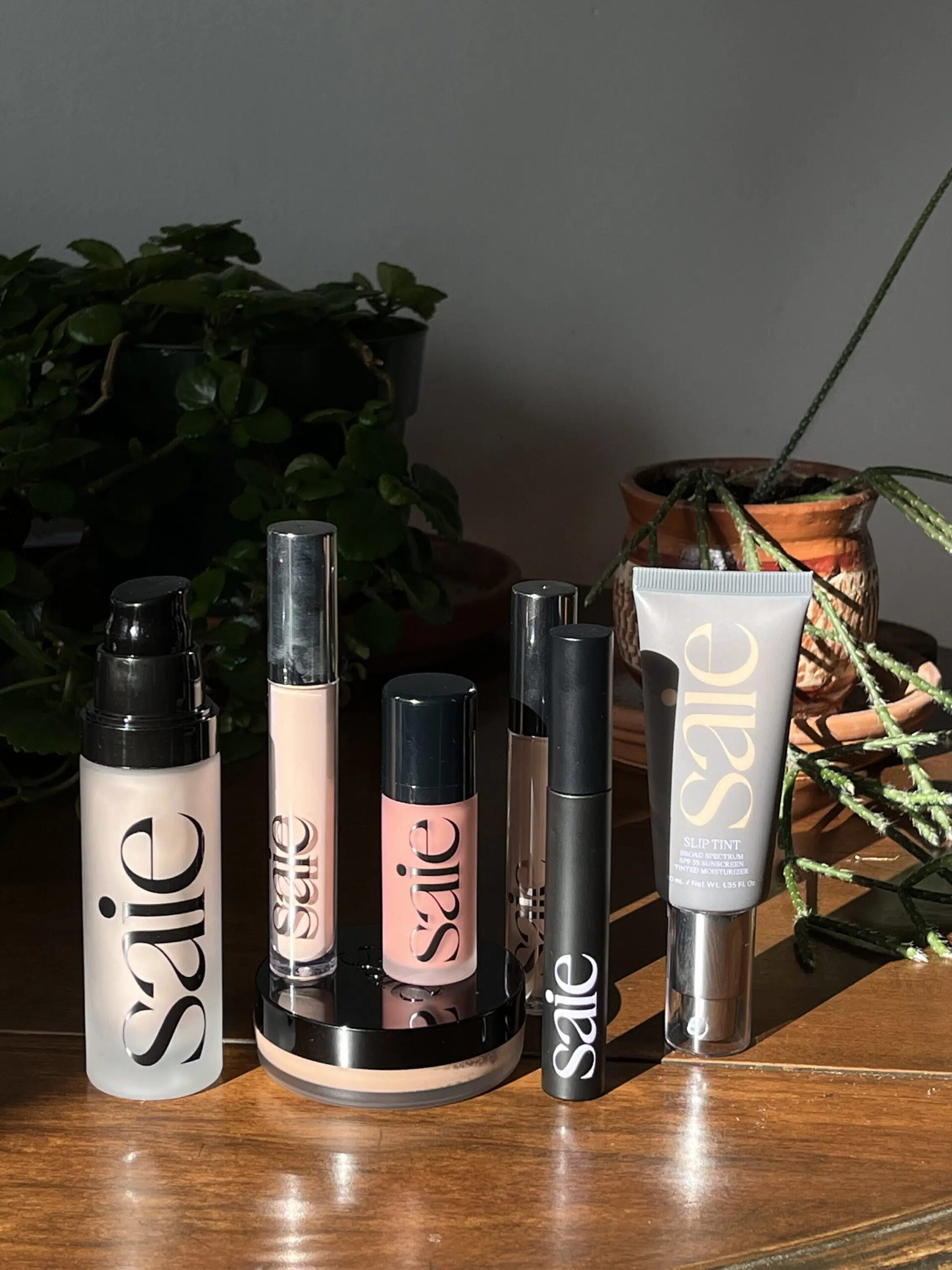 A lineup of Saie makeup products. 